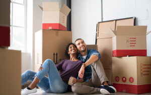 Happy couple packing boxes to move in Tulsa