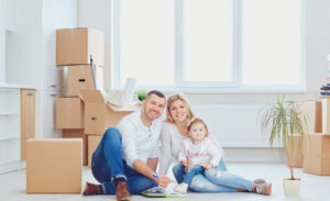 Happy couple packing boxes to move in Tulsa